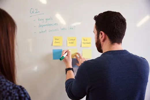 Kevin running a product planning workshop at a whiteboard